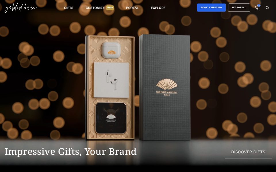 The GildedBox home page in the live prototype: the video hero behind the site header, the title Impressive Gifts, Your Brand, and the Discover Gifts link.